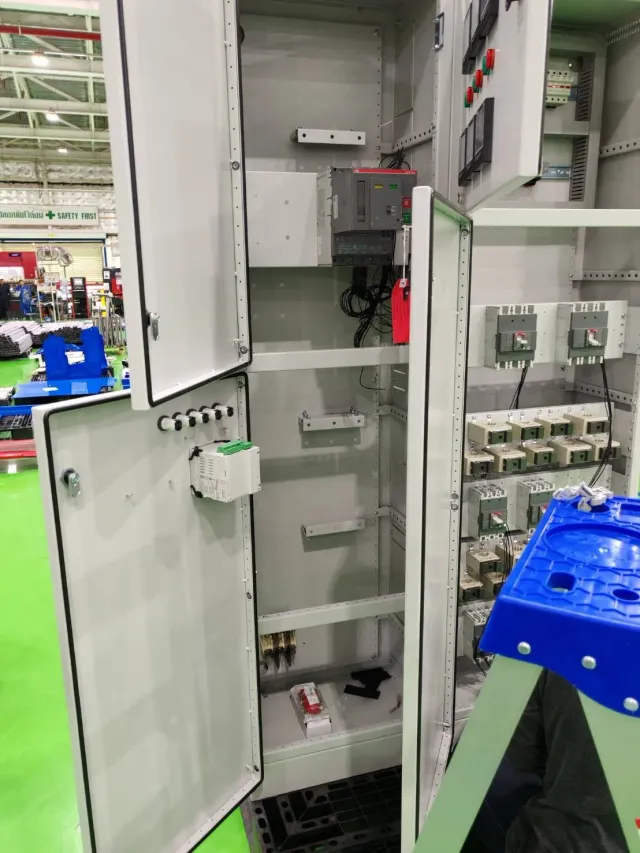 Electrical cabinet interior with wiring and mounted equipment