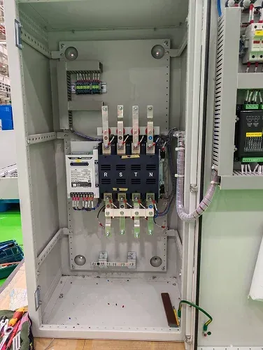 Open electrical cabinet showing wiring and contactors