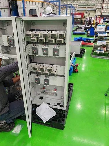 Electrical cabinet assembly with internal components exposed